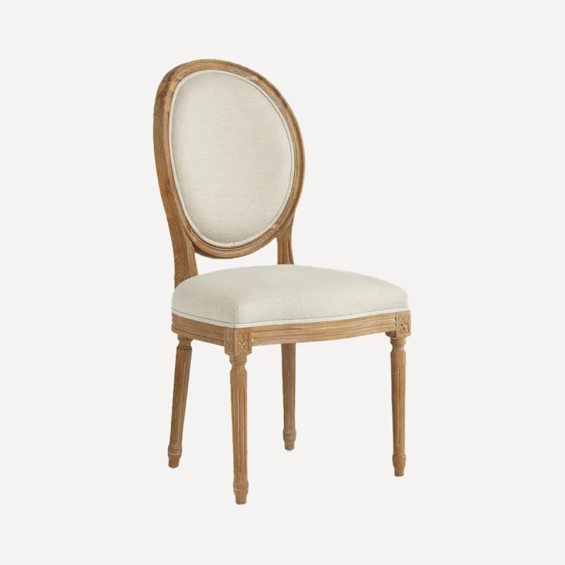 El Corte Inglés - Silla redonda de madera de roble tapizada en lino Fulham.