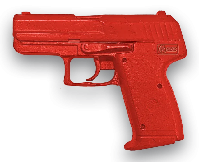 Pistola "real Training" K25. Peso: 765 G